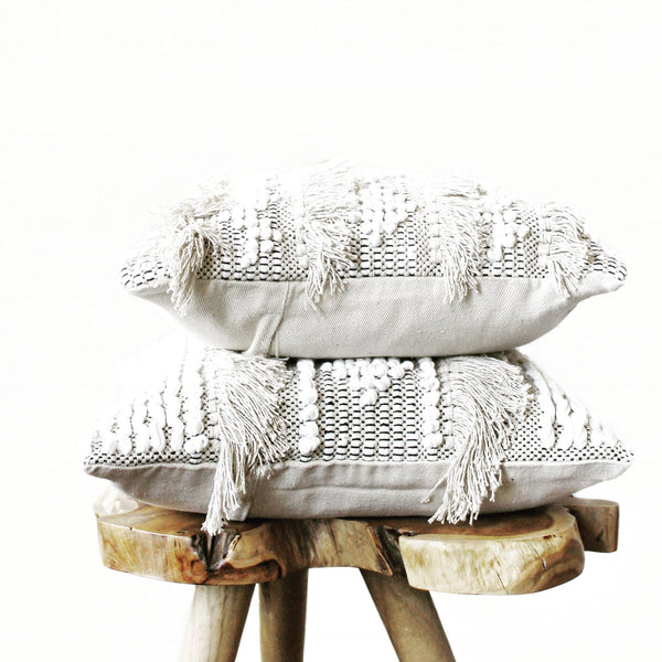 casa boho neutral cotton textured sea pillow cover with fringe beige Boho bohemian neutral decor cotton throw pillow tan beige white cream taupe pictured on wooden stand
